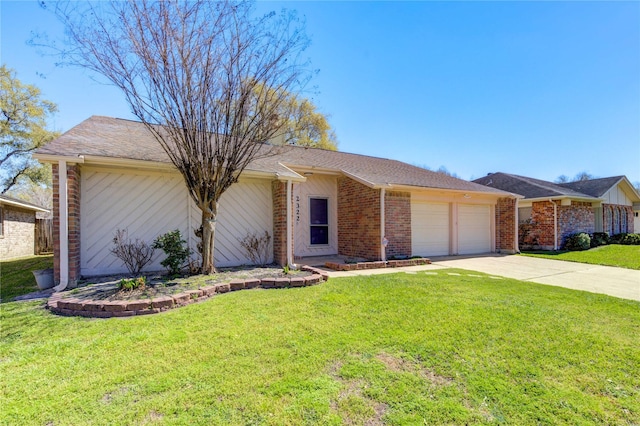 view of front of property featuring a front yard, concrete driveway, brick siding, and an attached garage