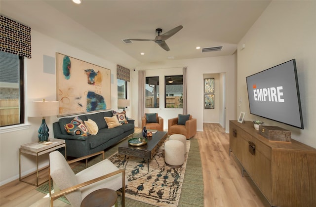 living area featuring a ceiling fan, recessed lighting, visible vents, and light wood finished floors