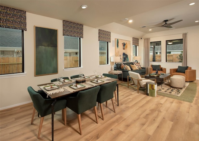 dining room featuring recessed lighting, light wood-type flooring, lofted ceiling, and a ceiling fan