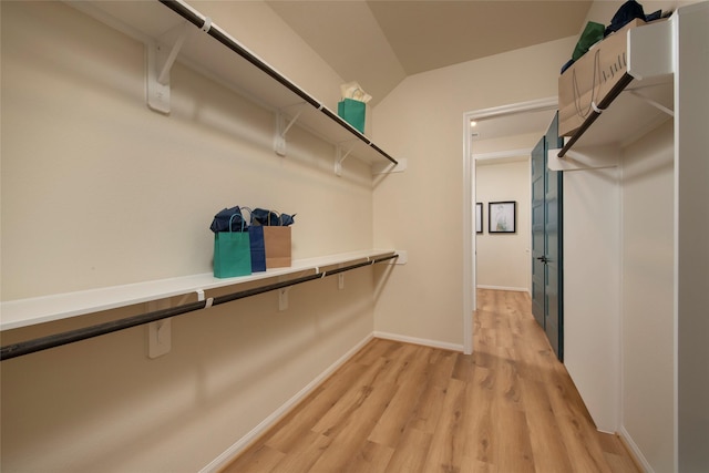 spacious closet featuring light wood-style flooring