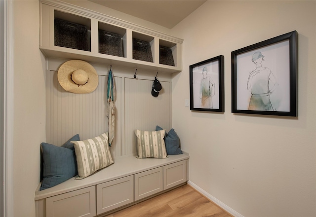 mudroom featuring baseboards and light wood-style flooring