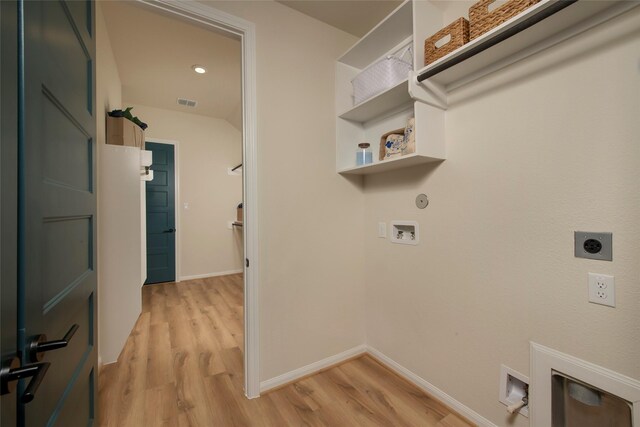 laundry room featuring light wood-type flooring, hookup for an electric dryer, hookup for a washing machine, and laundry area