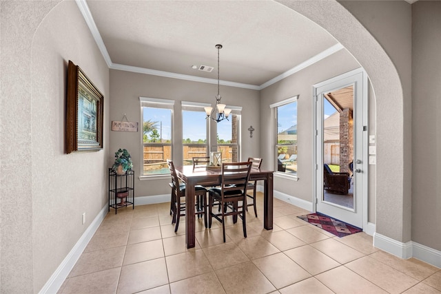 dining space featuring visible vents, arched walkways, light tile patterned flooring, crown molding, and a chandelier