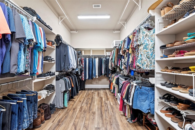 spacious closet with visible vents and wood finished floors