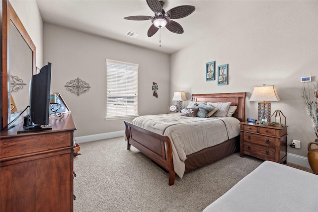 bedroom featuring visible vents, baseboards, light colored carpet, and ceiling fan