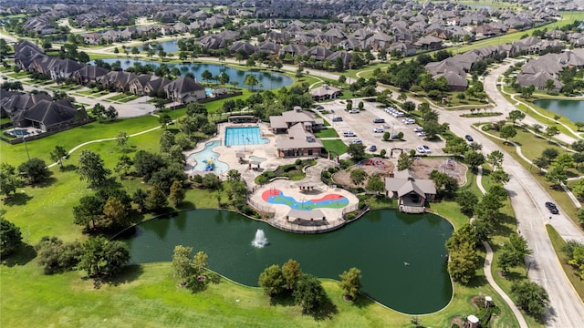 birds eye view of property with a residential view and a water view