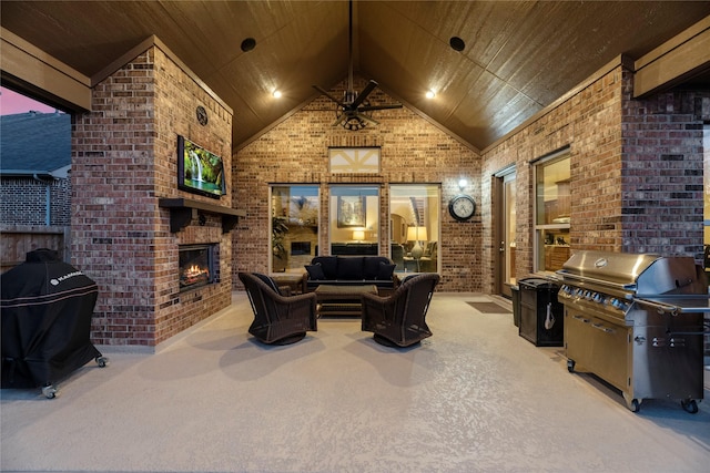 living room with carpet flooring, brick wall, wooden ceiling, and an outdoor brick fireplace