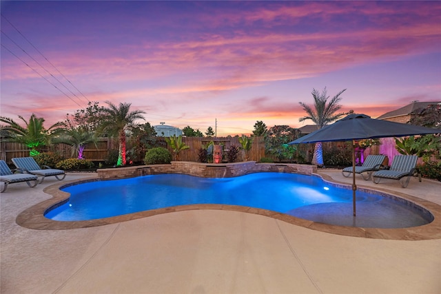 view of swimming pool with a fenced backyard, a fenced in pool, and a patio