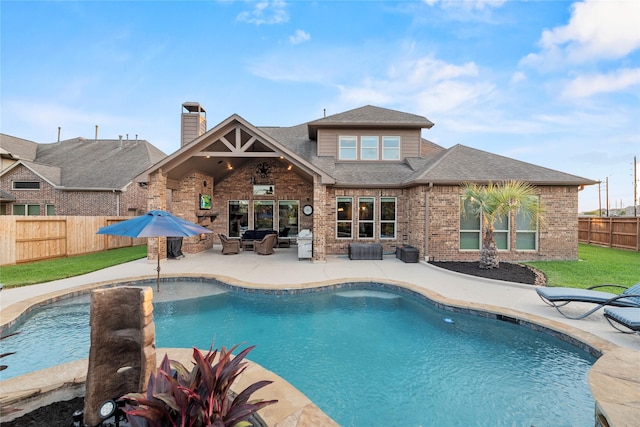 view of pool with a lawn, a patio, a fenced backyard, a grill, and a fenced in pool