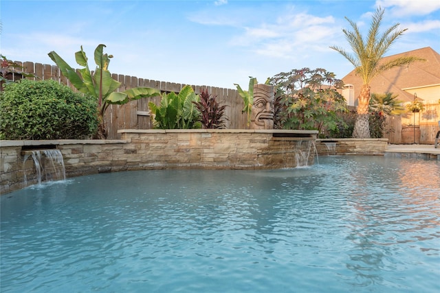 view of swimming pool with a fenced backyard and a fenced in pool