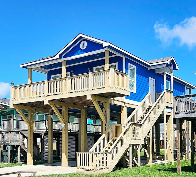 beach home featuring stairway