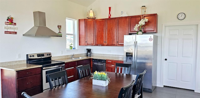 kitchen featuring a sink, reddish brown cabinets, appliances with stainless steel finishes, wall chimney exhaust hood, and light countertops