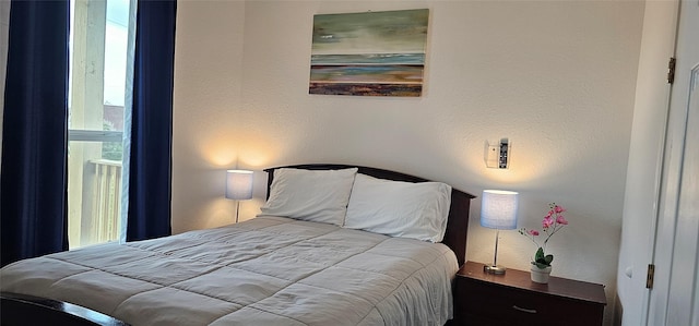 bedroom featuring a textured wall