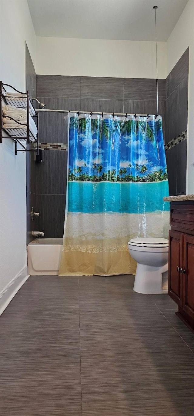 bathroom featuring shower / bath combination with curtain and toilet