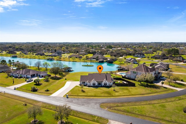 bird's eye view with a residential view and a water view