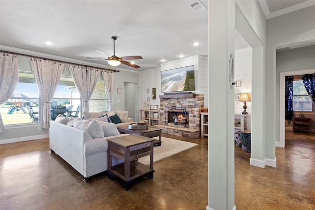 living room with visible vents, plenty of natural light, finished concrete flooring, and baseboards