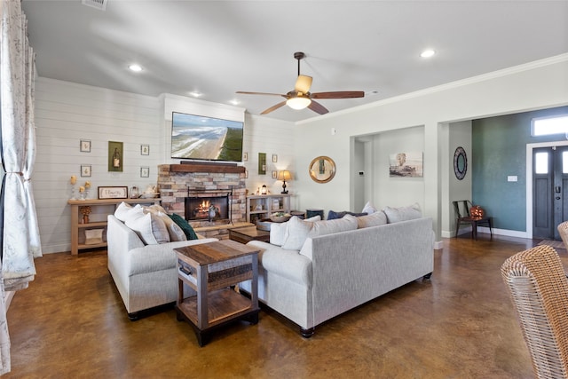 living area with a ceiling fan, finished concrete floors, recessed lighting, a fireplace, and baseboards