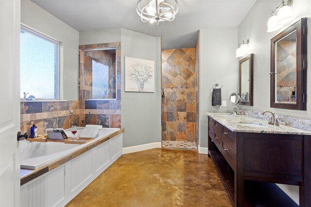 bathroom featuring finished concrete floors, baseboards, a garden tub, and a sink