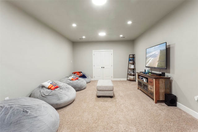 interior space featuring recessed lighting, baseboards, and light carpet