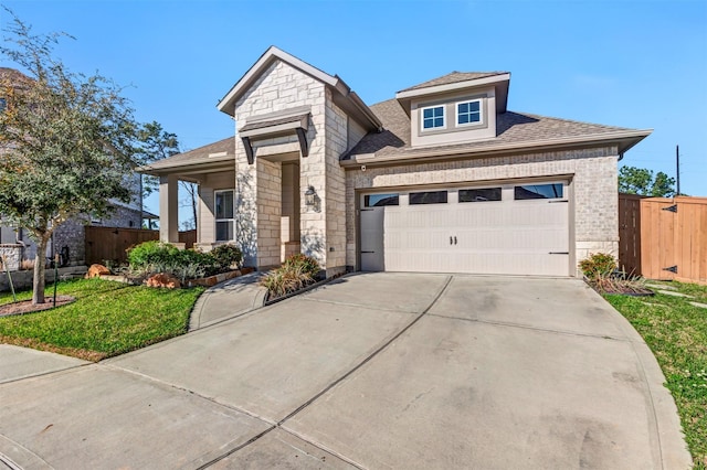 view of front of property with brick siding, stone siding, a garage, and fence