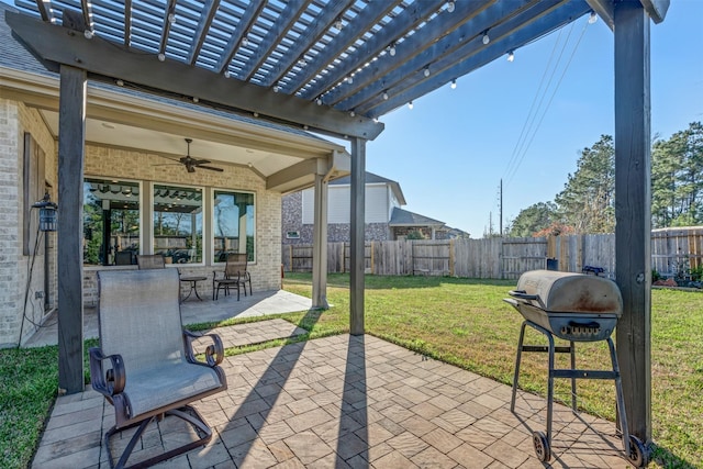 view of patio / terrace with area for grilling, ceiling fan, a pergola, and a fenced backyard