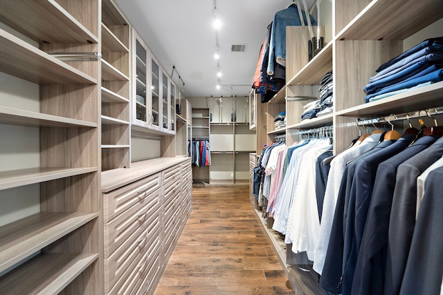 spacious closet with wood finished floors and visible vents