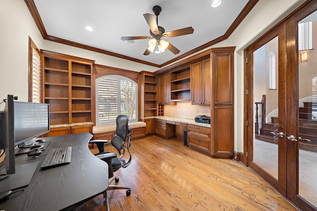 home office featuring crown molding, ceiling fan, built in desk, recessed lighting, and light wood-style flooring