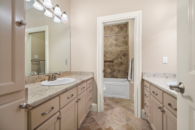 bathroom featuring baseboards, shower / bathtub combination, toilet, and vanity