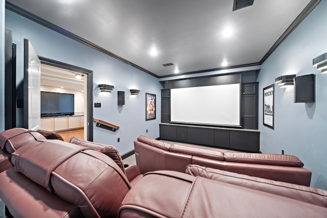 cinema with recessed lighting, visible vents, and ornamental molding