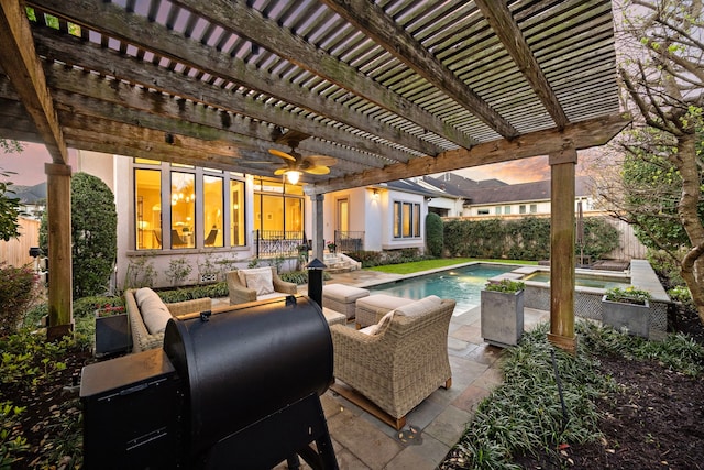 view of patio / terrace featuring grilling area, a pool with connected hot tub, a pergola, and fence