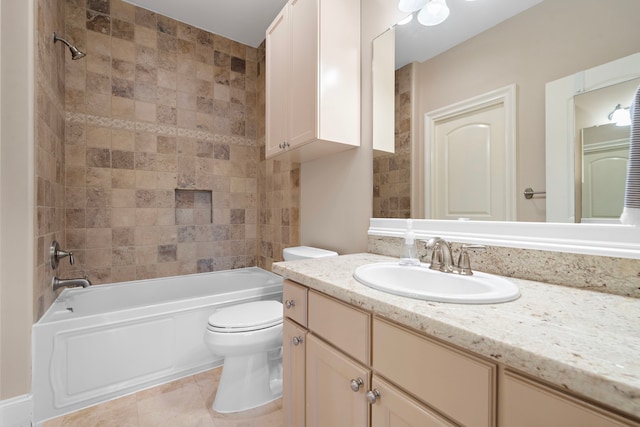 bathroom featuring tile patterned floors, toilet, vanity, and shower / tub combination