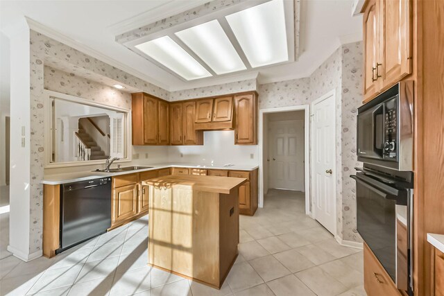 kitchen with black appliances, a sink, a center island, light tile patterned flooring, and wallpapered walls