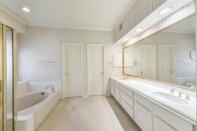 full bath with a whirlpool tub, ornamental molding, wallpapered walls, and a sink