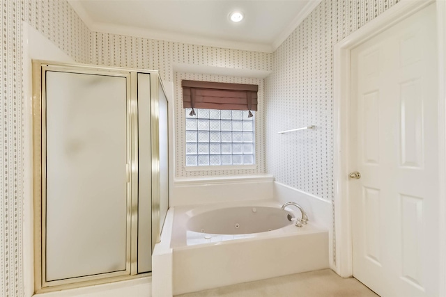 bathroom featuring a tub with jets, a stall shower, and wallpapered walls