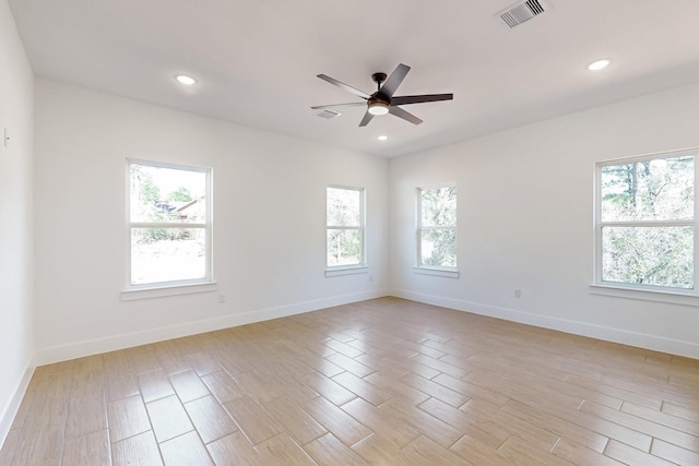 empty room featuring recessed lighting, visible vents, baseboards, and light wood-style flooring