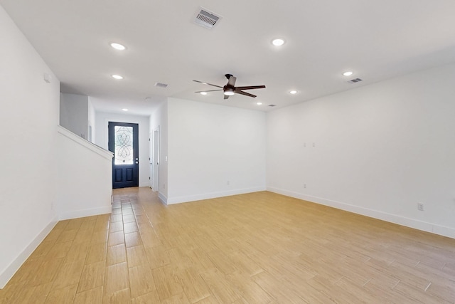 empty room with recessed lighting, visible vents, and light wood finished floors