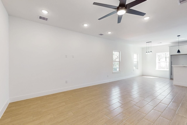 interior space with visible vents, light wood-style floors, and ceiling fan