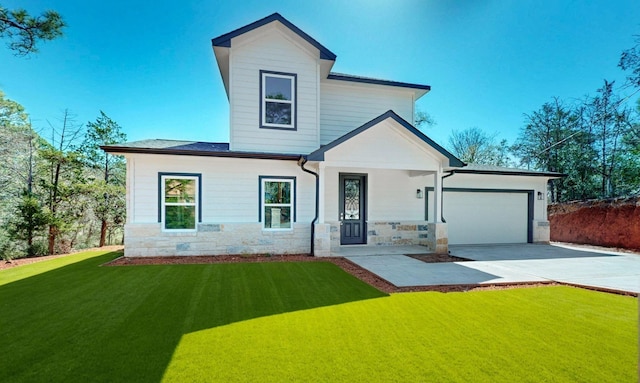 view of front of house featuring concrete driveway, a garage, stone siding, and a front lawn