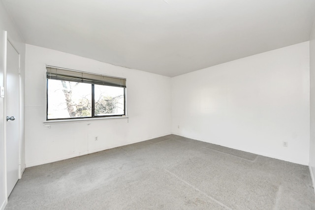 unfurnished room with carpet flooring