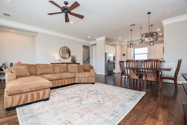 living room featuring dark wood-style floors, visible vents, and baseboards