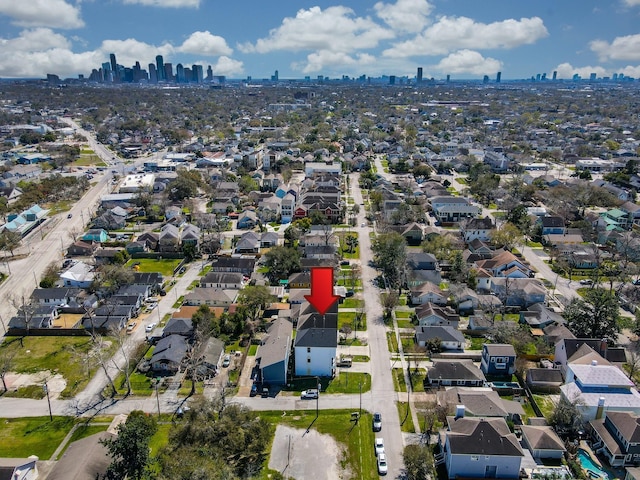 birds eye view of property with a view of city