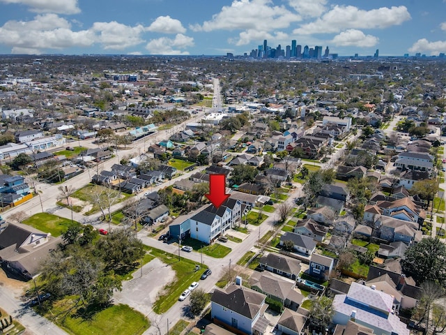 birds eye view of property with a view of city