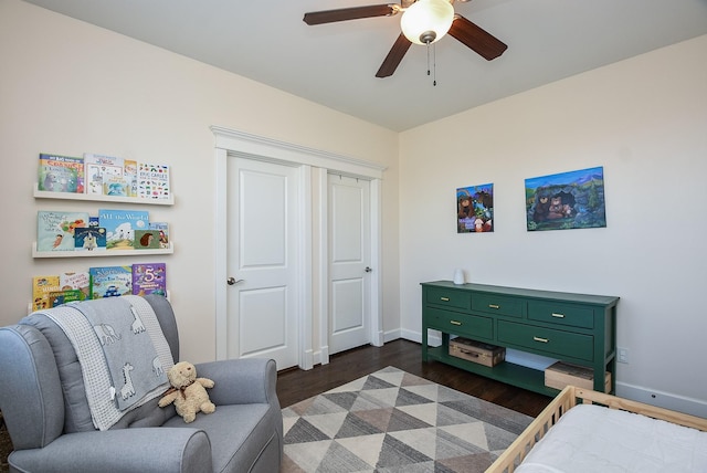 bedroom featuring dark wood finished floors, ceiling fan, and baseboards