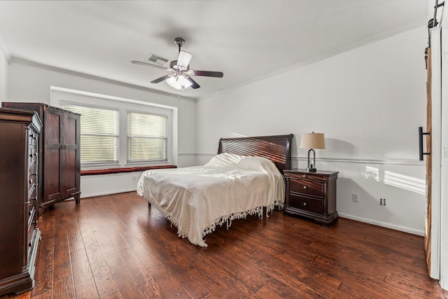 bedroom with visible vents, baseboards, dark wood-type flooring, and ornamental molding