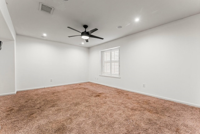 carpeted spare room featuring recessed lighting, visible vents, ceiling fan, and baseboards