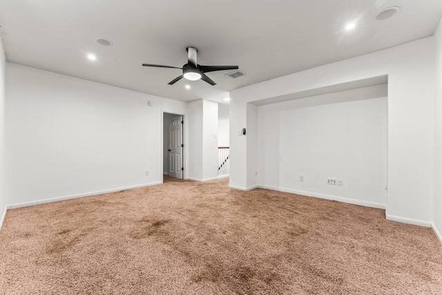 carpeted empty room featuring recessed lighting, visible vents, baseboards, and ceiling fan