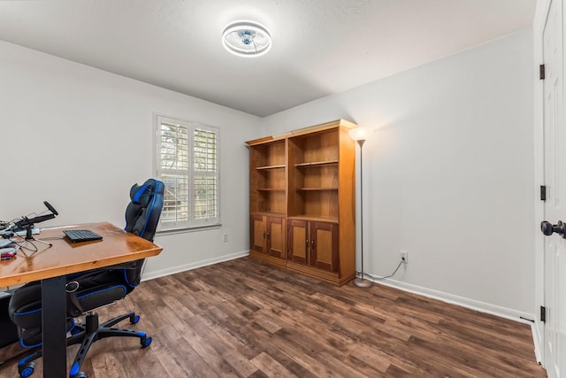 office featuring baseboards and dark wood-type flooring