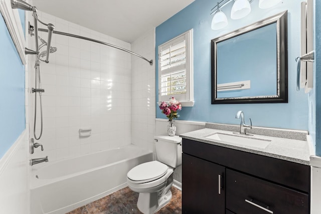 bathroom with vanity, toilet, and shower / bath combination