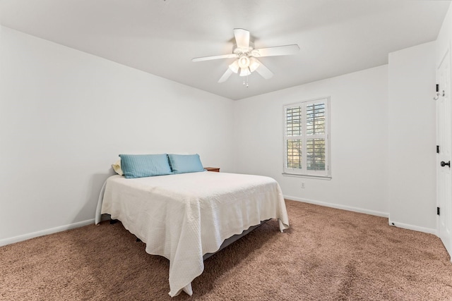 carpeted bedroom with a ceiling fan and baseboards