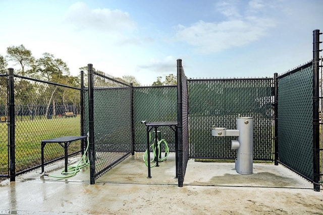 view of gate with fence